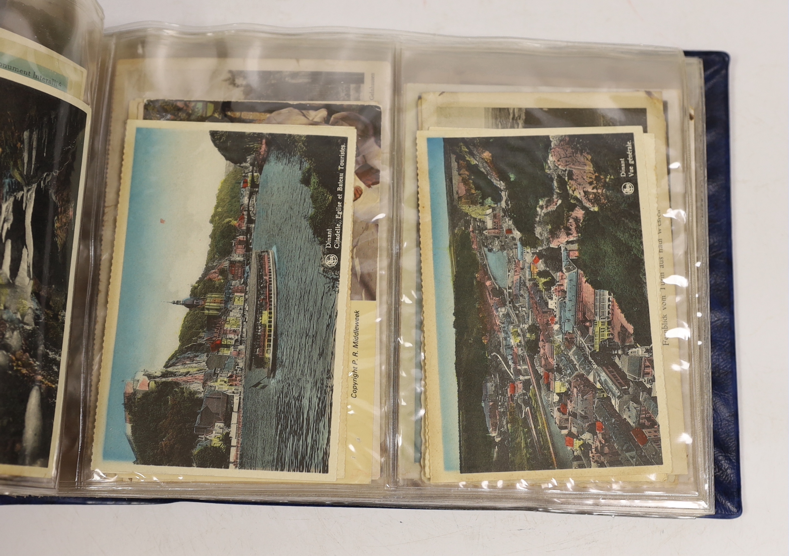 A postcard album, largely continental topography, and eight cards relating to car and motorcycle racing